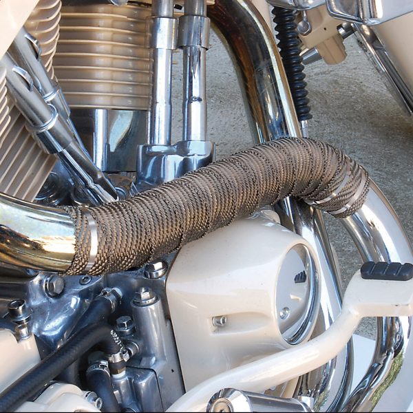 Titanium exhaust wrap installed on a motorcycle exhaust system to reduce radiant heat Titanium exhaust wrap installed on a motorcycle exhaust system to reduce radiant heat